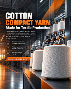 Spools of cotton compact yarn in a textile manufacturing facility