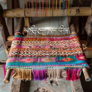 Close-up of a traditional handloom weaving a colorful rug