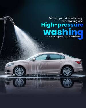 A silver car being washed with a high-pressure water spray.