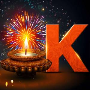 Diwali diya and the letter K with fireworks