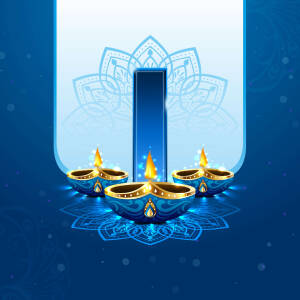 A decorative image of a lit diya lamp with a blue and gold mandala background, representing Diwali.