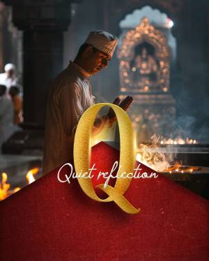 A man praying at a Hindu temple with a large golden 'Q' overlayed on the image.