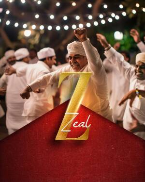 Group of men in traditional white clothing celebrating with a large 'Z' logo.