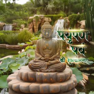 A bronze Buddha statue in a serene garden setting with a waterfall and lotus flowers.