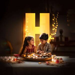 Two children celebrating Diwali with lights and sweets.