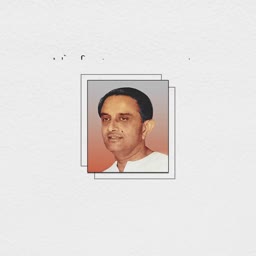 A formal portrait of an Indian man within a minimalist square frame against a light textured background