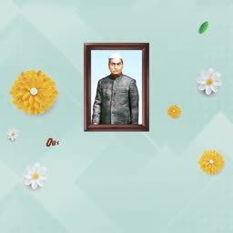 A framed portrait of Dr. Rajendra Prasad decorated with yellow and white flowers on a light blue background