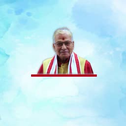 An elderly Indian man with white hair and glasses wearing a traditional stole