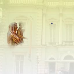 An Indian woman in a traditional veil stands in front of a colonial-style building with a faded artistic overlay.