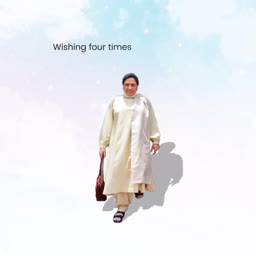 Mamata Banerjee wearing a light yellow kurta and carrying a brown bag