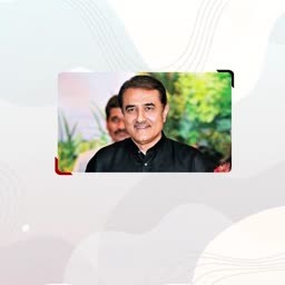 A formal portrait of Pakistani politician Muhammad Mian Soomro smiling at a public event.