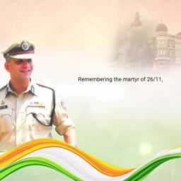 An Indian police officer honoring the martyrs of the 26/11 Mumbai terror attacks with the Taj Mahal Palace hotel in the background.