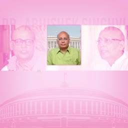 Dr. Abhishek Manu Singhvi posing in a green shirt with a building in the background