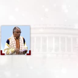 A senior Indian politician wearing glasses and a traditional shawl, speaking in a parliamentary setting.