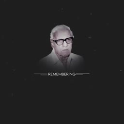 A grayscale portrait of an elderly man with glasses, captioned with the word Remembering.