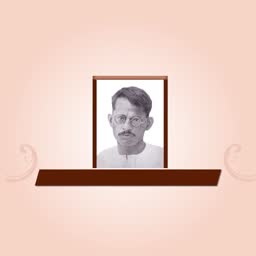 A framed black and white portrait of a man with glasses on a peach-colored background