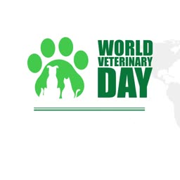 Green paw print icon with dog and cat silhouettes celebrating World Veterinary Day