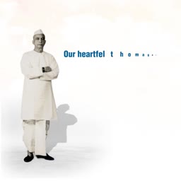 A man in traditional Indian attire standing respectfully as a tribute