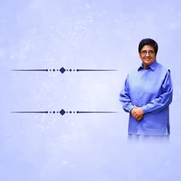 Kiran Bedi wearing a blue shirt smiling against a light blue background