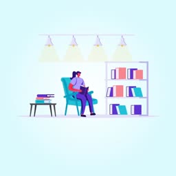 A person sitting in a blue armchair in a library, reading a book next to a bookshelf.