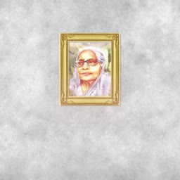 A framed portrait of an elderly woman wearing glasses on a gray textured wall.