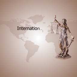 Themis statue representing international law with a world map background