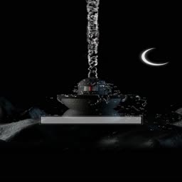 A sacred Shiva Lingam with water flowing over it during a moonlit night
