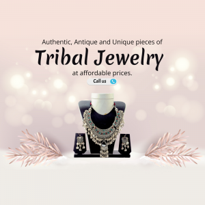 A display of an antique-style silver tribal necklace and earring set on a pedestal against a blurred bokeh background.