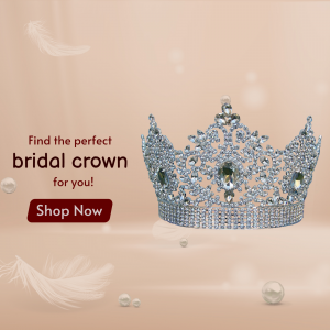 A crystal-encrusted bridal crown displayed against a soft, light-brown background with pearls and feathers.
