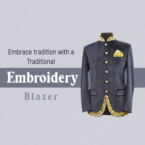 A man's navy blue velvet blazer with gold embroidery and a pocket square on a light gray background