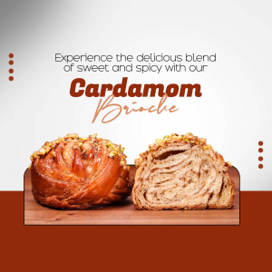 A freshly baked cardamom brioche pastry cut in half sitting on a wooden surface with a gradient background