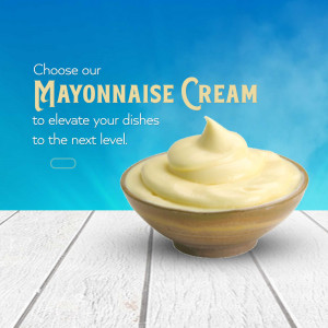 A bowl of creamy mayonnaise on a white wooden table with a blue background