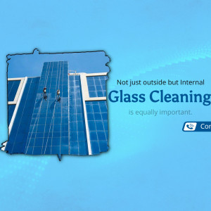Professional window cleaners scaling a modern blue glass building