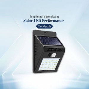 A modern black solar powered LED outdoor wall light with motion sensor on a light blue gradient background.