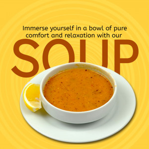 A white bowl filled with orange vegetable soup served with a lemon wedge on a vibrant yellow background