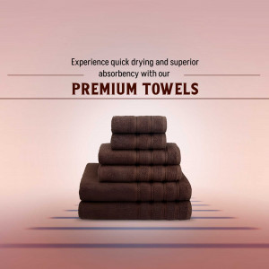 A stack of dark brown premium towels on a soft pink gradient background