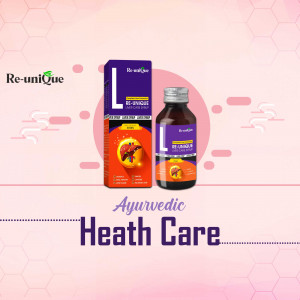 Bottle and packaging box of Re-Unique Ayurvedic liver care syrup on a pink background