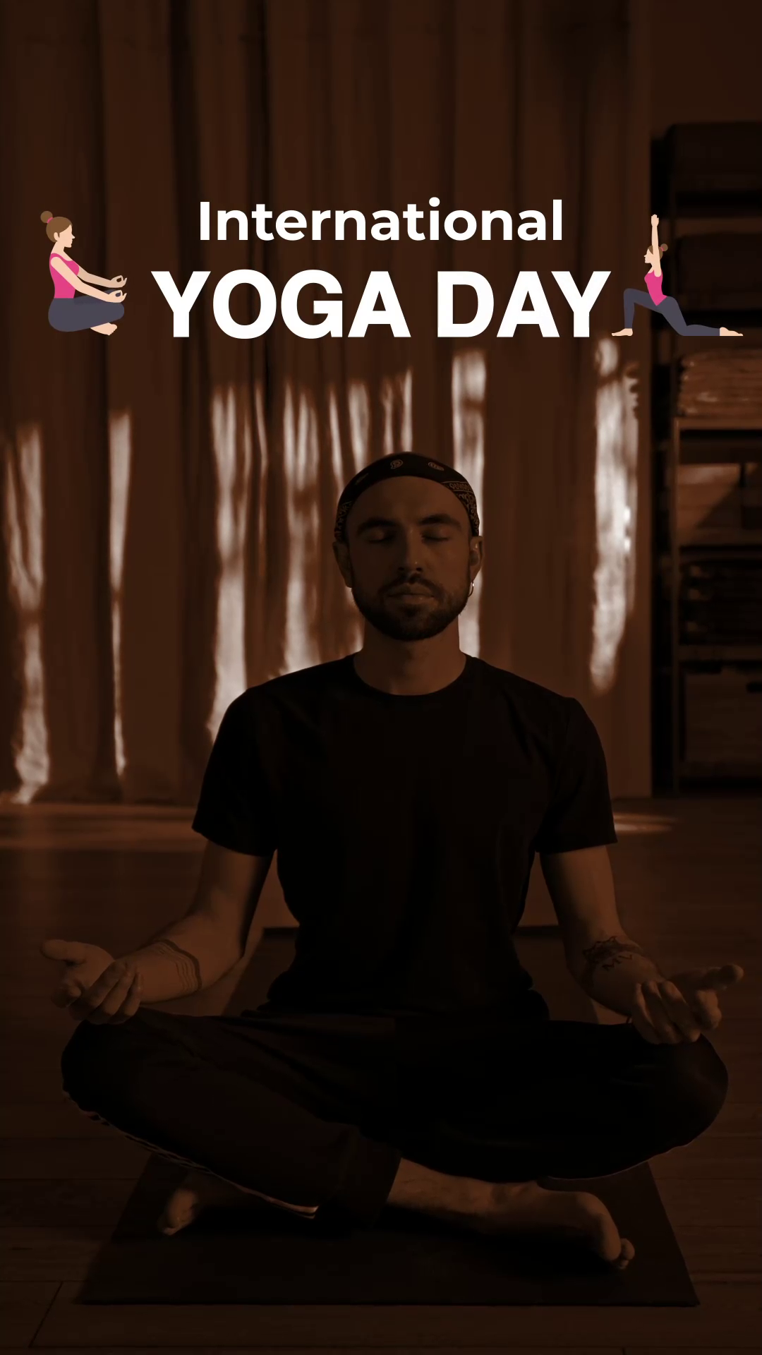 A man meditating in a dim room with curtains background to celebrate International Yoga Day
