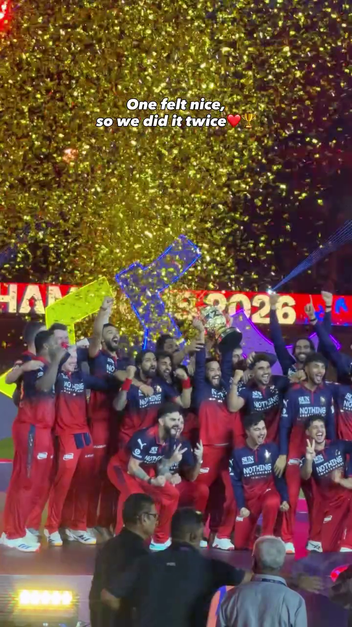 Royal Challengers Bengaluru cricket team celebrating victory with gold confetti and trophy