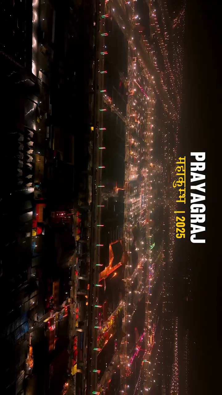 Aerial night view of the Prayagraj Mahakumbh 2025 fairgrounds illuminated with lights