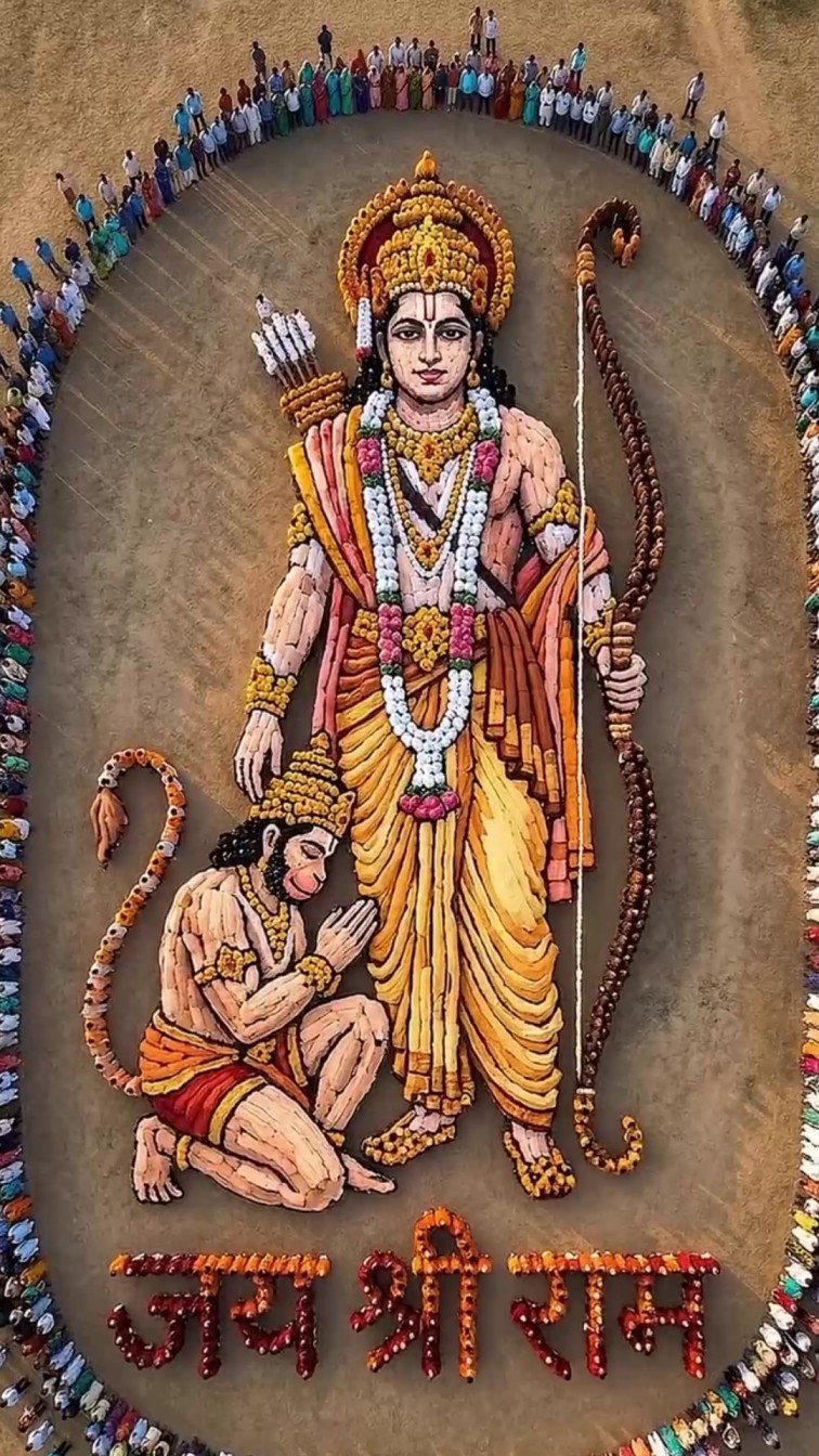 A massive human formation creating the image of Lord Rama and Hanuman, surrounded by a large crowd.