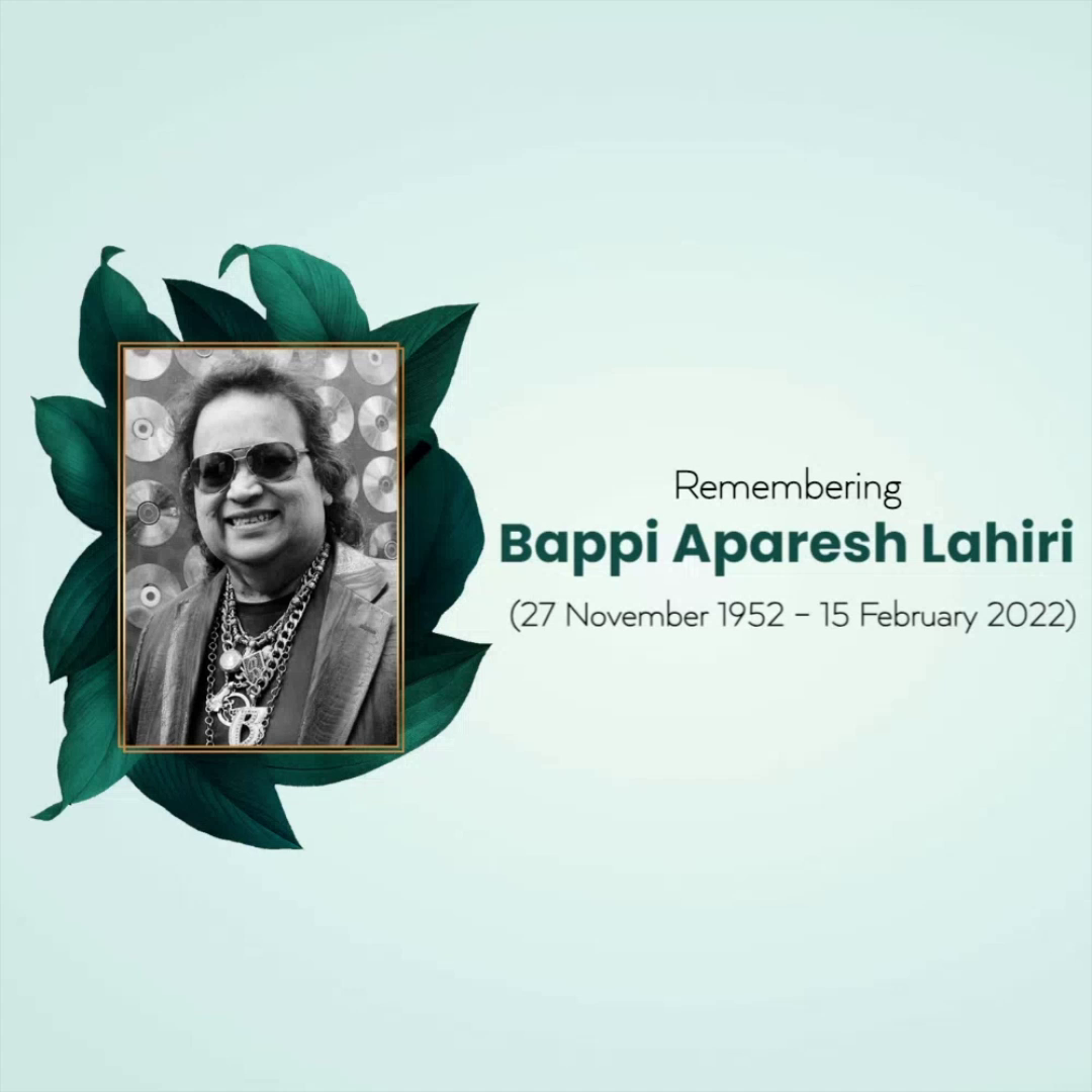 A memorial tribute image for Indian music composer Bappi Lahiri featuring his portrait surrounded by green leaves.