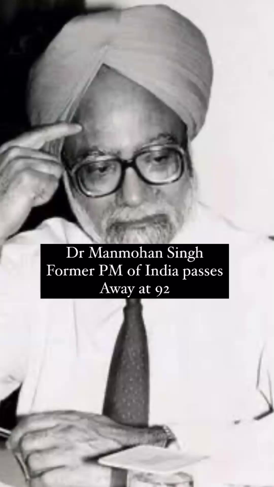 Dr. Manmohan Singh, former Prime Minister of India, in a black and white portrait.