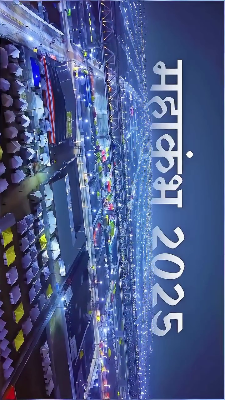 Aerial night view of Mahakumbh 2025 event grounds with illuminated tents and bridge structure