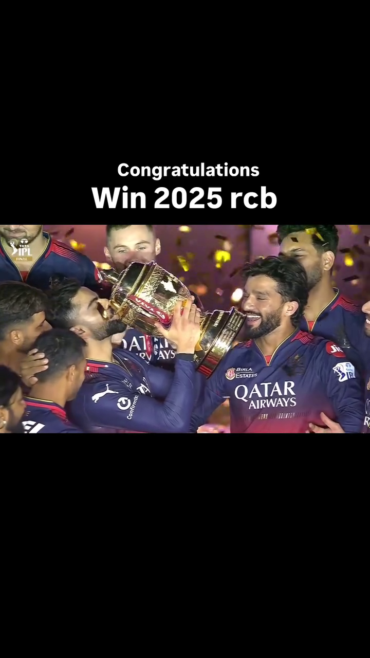 Royal Challengers Bangalore players celebrating with the IPL trophy