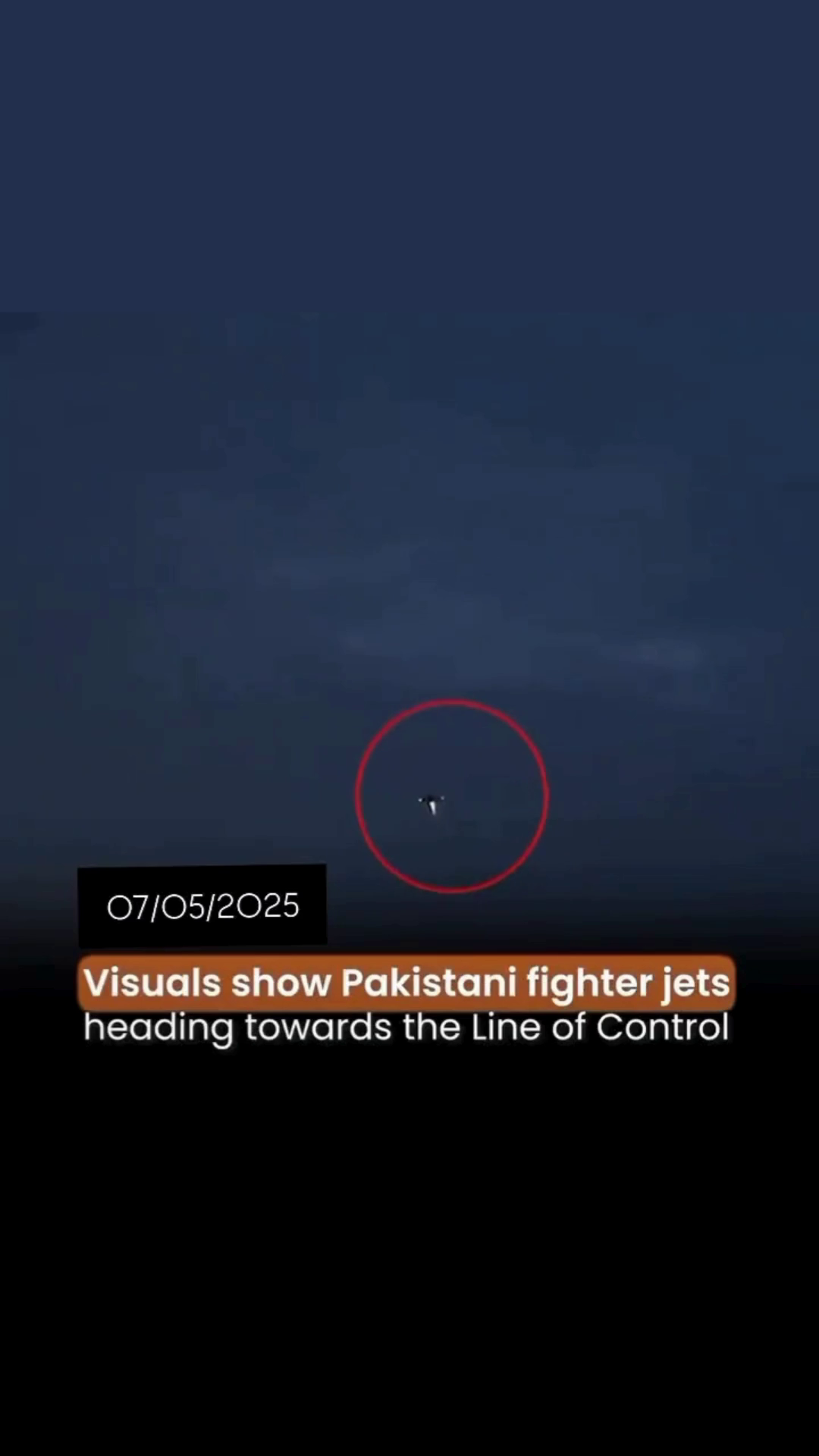 A grainy image of a fighter jet flying in a dark sky with a red circle highlighting the aircraft.