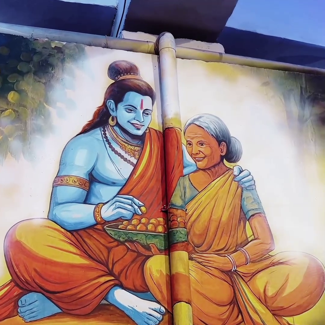 A mural painting of Lord Rama sitting with the elderly devotee Shabari