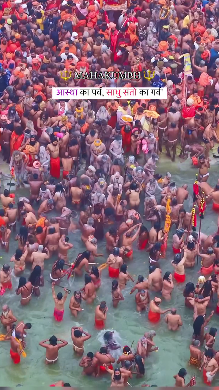 Crowd of sadhus and devotees bathing in the holy river during Maha Kumbh Mela