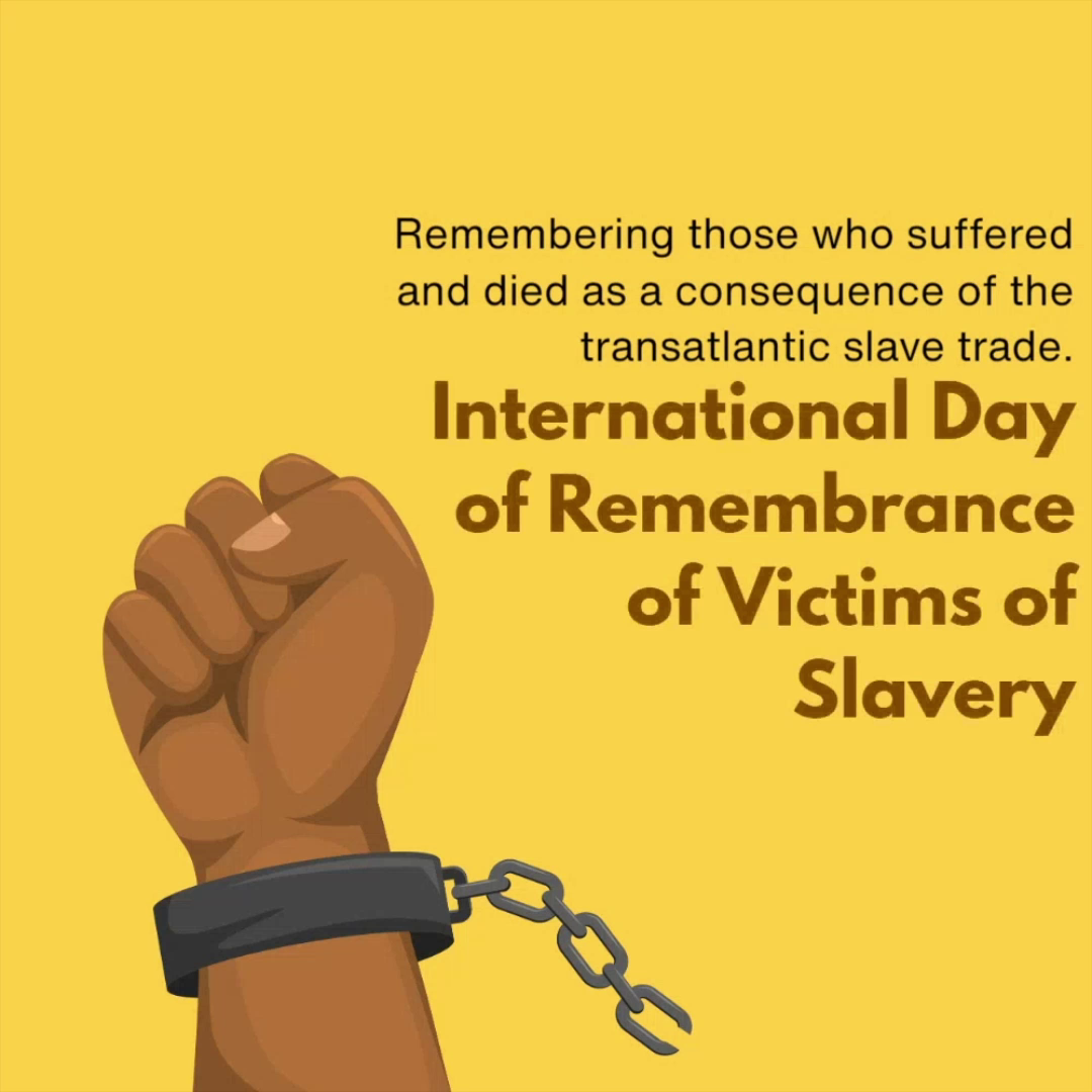A fist raised in defiance wearing a broken chain against a yellow background, representing the International Day of Remembrance of Victims of Slavery and the Transatlantic Slave Trade.