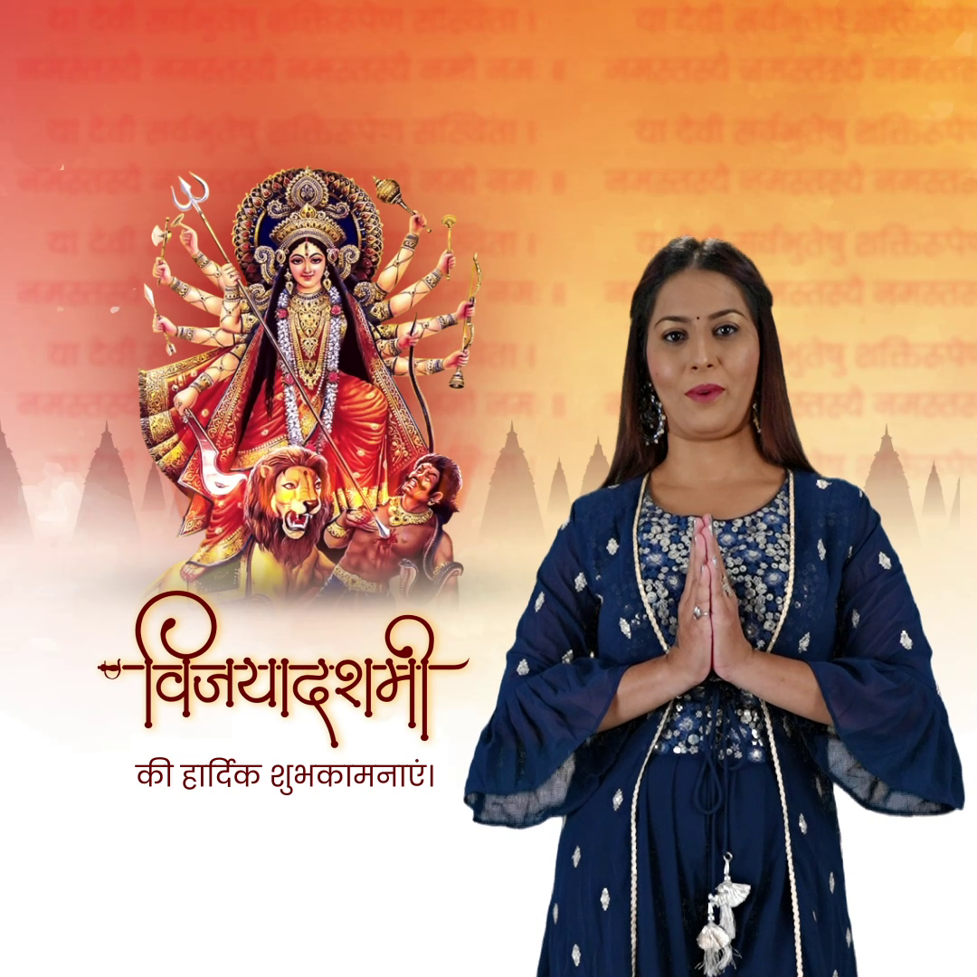 A woman in a blue traditional outfit giving a greeting gesture with Goddess Durga in the background for Vijaya Dashami.